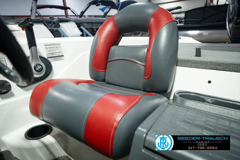 Slide: The Image of Red and gray seat in a 1998 Nitro 700 LX SC boat cockpit. - 40