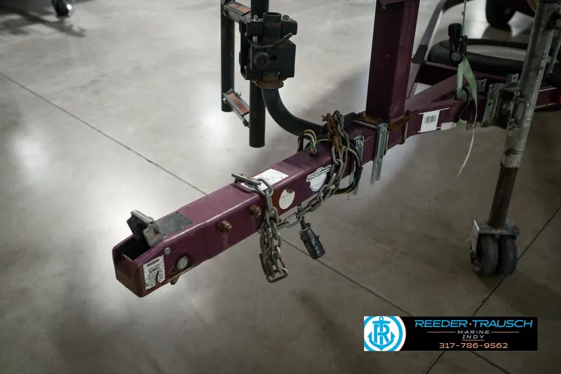 Slide: The Image of Trailer hitch of a 1998 Nitro 700 LX SC boat, secured with chains and lock. - 58