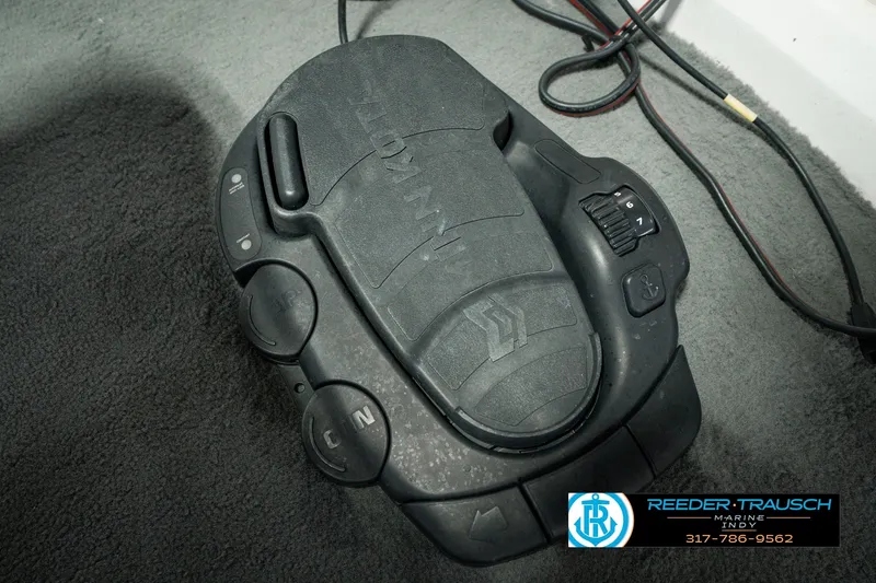 Slide: The Image of Close-up of a Nitro 700 LX SC boat control panel, 1998 model, on a carpeted surface. - 54