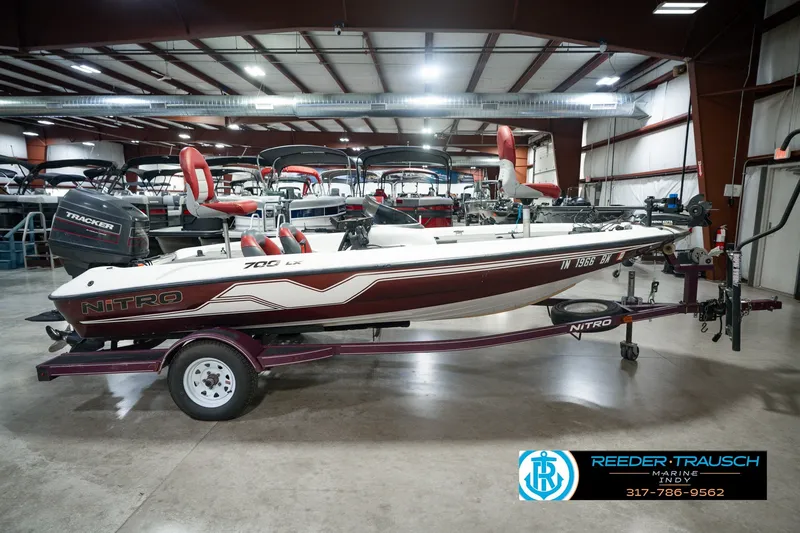 Slide: The Image of 1998 Nitro 700 LX SC boat on trailer in indoor showroom. - 5