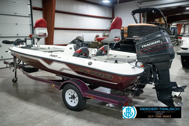 Slide: The Image of 1998 Nitro 700 LX SC fishing boat with Tracker outboard motor in showroom. - 9