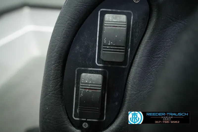 Slide: The Image of Close-up of control switches on a 1998 Nitro 700 LX SC boat dashboard. - 33