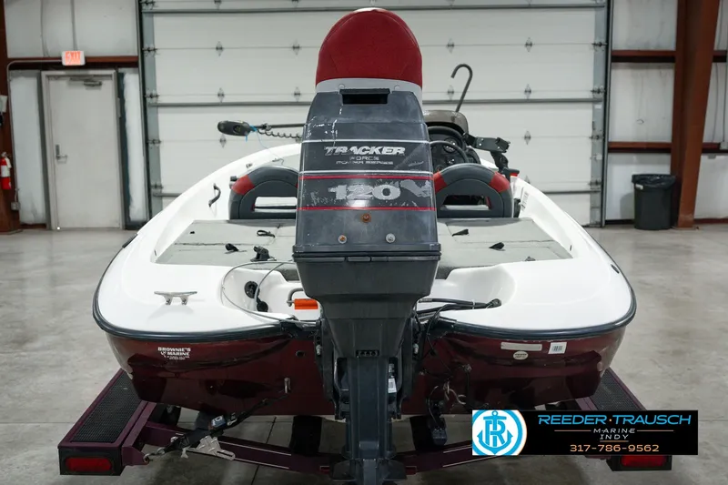 Slide: The Image of 1998 Nitro 700 LX SC boat with Tracker 120 engine in a garage setting. - 8