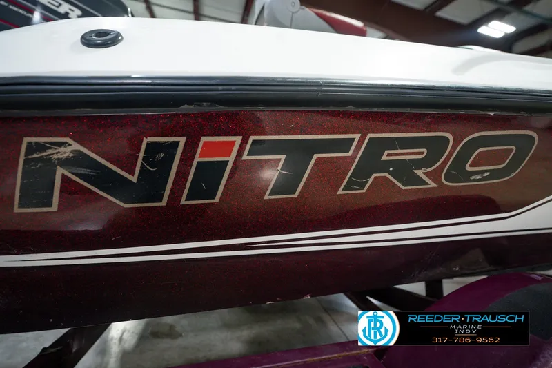 Slide: The Image of 1998 Nitro 700 LX SC boat with visible logo and Reeder-Trausch Marine contact details. - 56