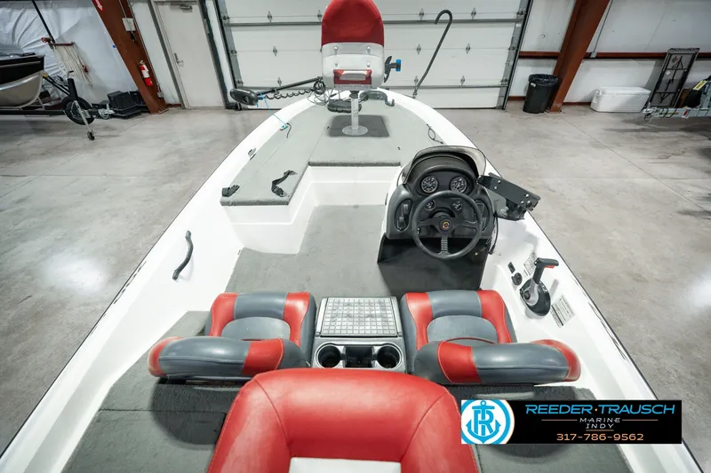 Slide: The Image of 1998 Nitro 700 LX SC boat interior with red and gray seating, steering console, and controls. - 17