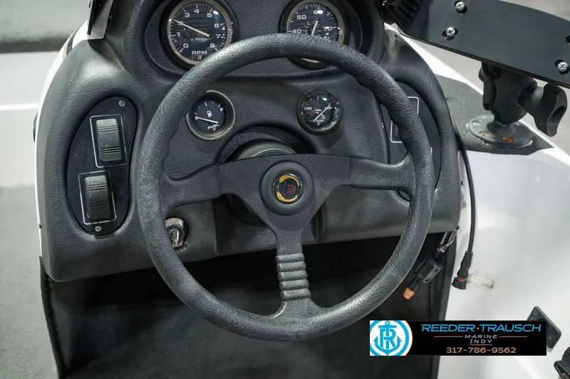 Slide: The Image of Steering wheel and dashboard of a 1998 Nitro 700 LX SC boat. - 30