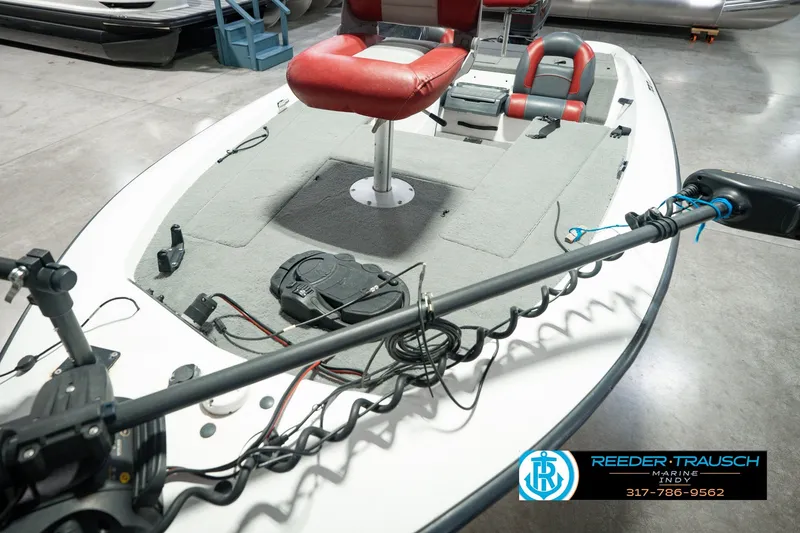 Slide: The Image of 1998 Nitro 700 LX SC boat interior with red seats and fishing equipment. - 12