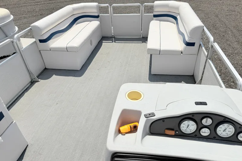Slide: The Image of 2001 Harris Cruiser 220 pontoon boat interior with white seating and control panel. - 12