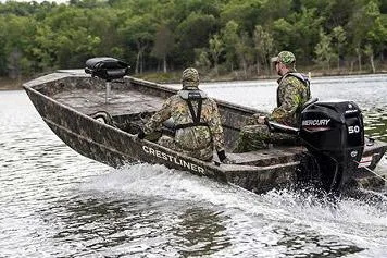 Slide: The Image of Manufacturer Provided Image: 2026 Crestliner 1760 Retriever Jon Deluxe boat with camo design on a lake. - 13