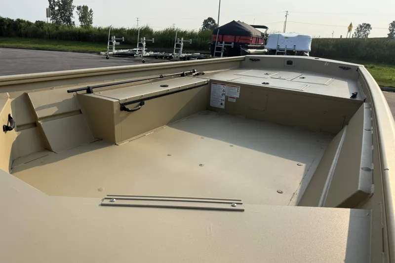 Slide: The Image of 2026 Crestliner 1760 Retriever Jon boat interior, showcasing spacious deck and storage compartments. - 4