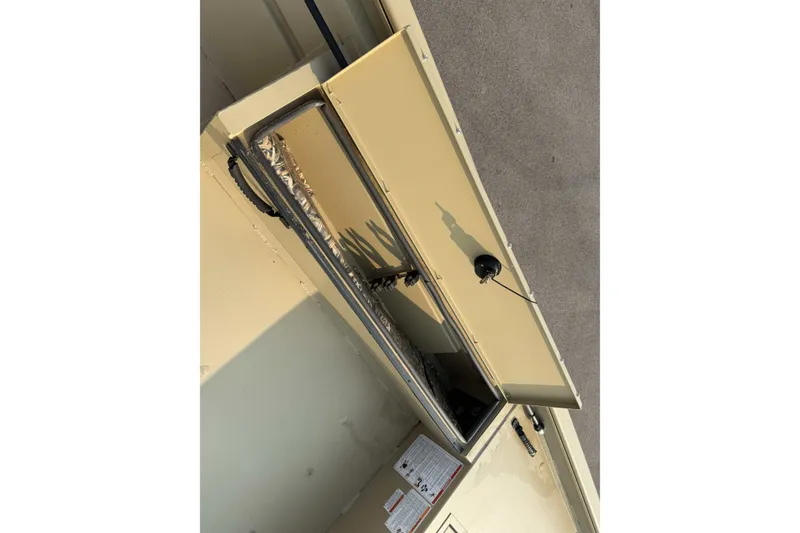 Slide: The Image of Open storage compartment on 2026 Crestliner 1760 Retriever Jon boat. - 10