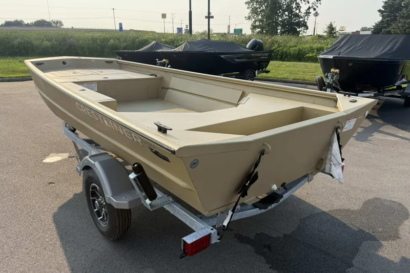 Slide: The Image of 2026 Crestliner 1760 Retriever Jon boat on trailer, parked outdoors. - 3