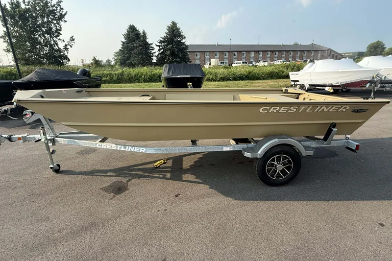 Slide: The Image of 2026 Crestliner 1760 Retriever Jon boat on trailer, parked outdoors. - 1