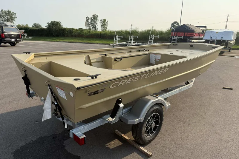 Slide: The Image of 2026 Crestliner 1760 Retriever Jon boat on trailer in parking lot. - 2