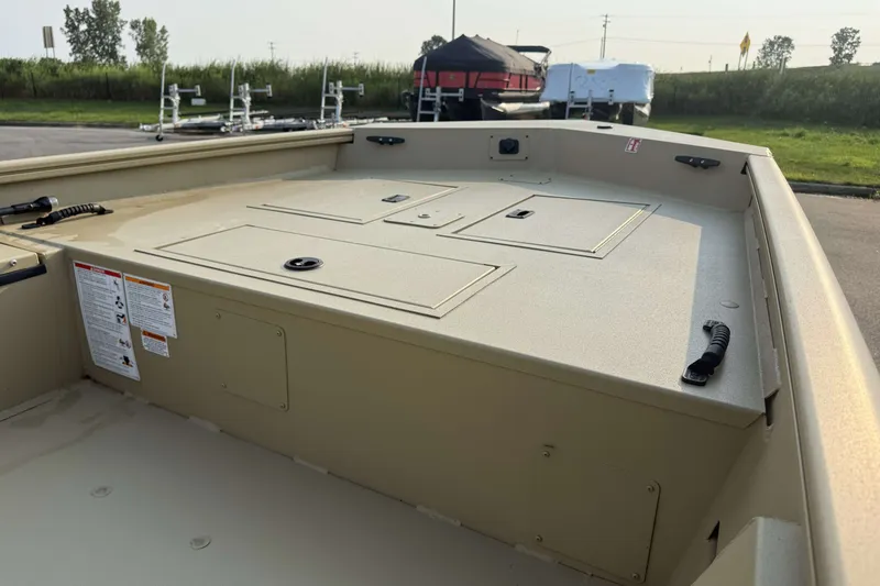 Slide: The Image of 2026 Crestliner 1760 Retriever Jon boat, showcasing storage compartments and durable design. - 5