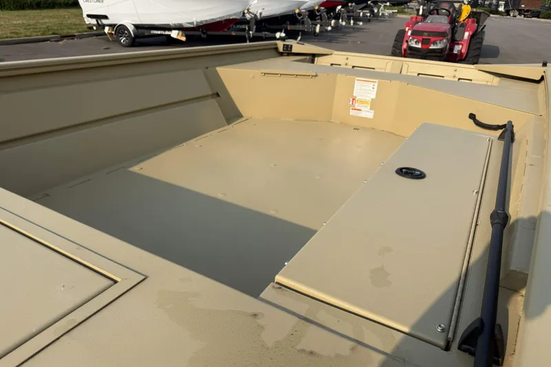Slide: The Image of 2026 Crestliner 1760 Retriever Jon boat interior, showcasing spacious deck and storage compartments. - 9