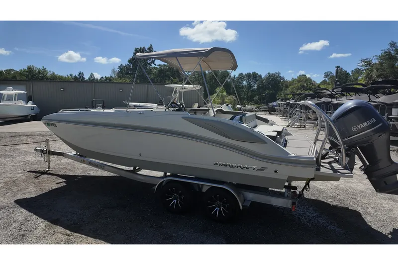 Slide: The Image of 2017 Starcraft Crossover 231 SCX OB boat with Yamaha outboard motor on trailer. - 3