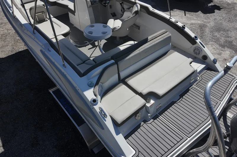 Slide: The Image of 2017 Starcraft Crossover 231 SCX OB boat interior with seating and table, viewed from above. - 9