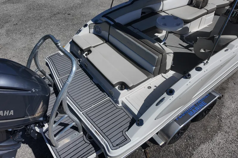 Slide: The Image of 2017 Starcraft Crossover 231 SCX OB boat with Yamaha engine, featuring spacious seating and swim platform. - 4