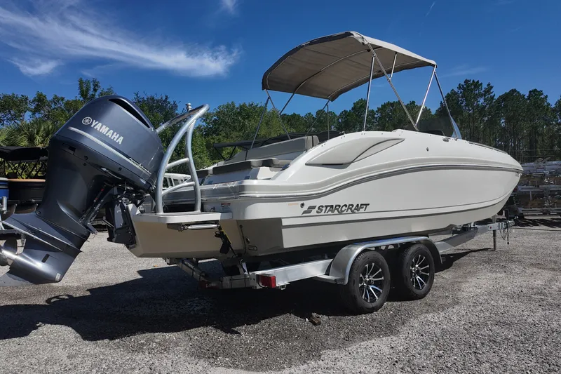 Slide: The Image of 2017 Starcraft Crossover 231 SCX OB boat with Yamaha outboard motor on trailer. - 2