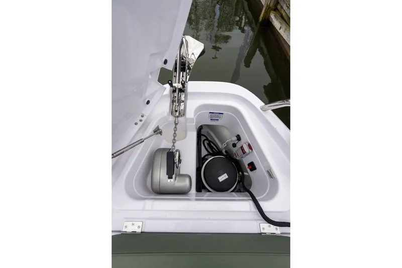 Slide: The Image of Anchor compartment of 2027 Axopar 38 Cross Cabin boat, featuring anchor and winch system. - 28