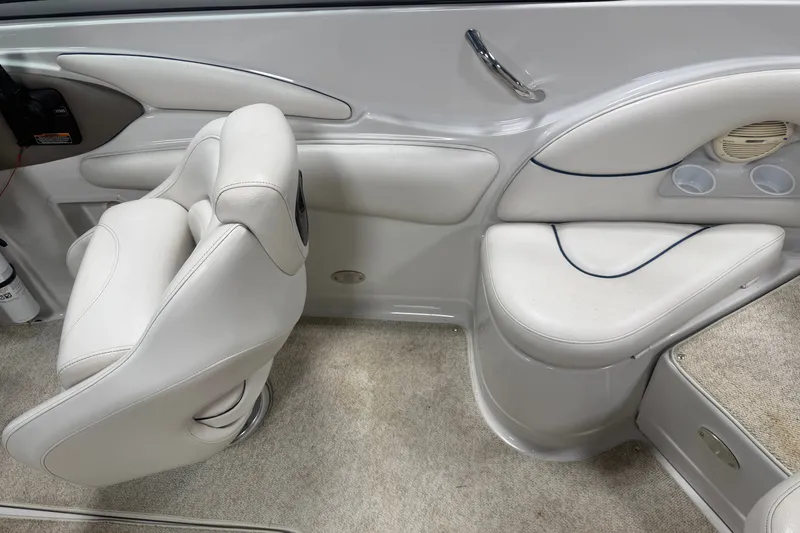Slide: The Image of Interior of a 2005 Crownline 226 LS boat with white seating and carpeted flooring. - 23