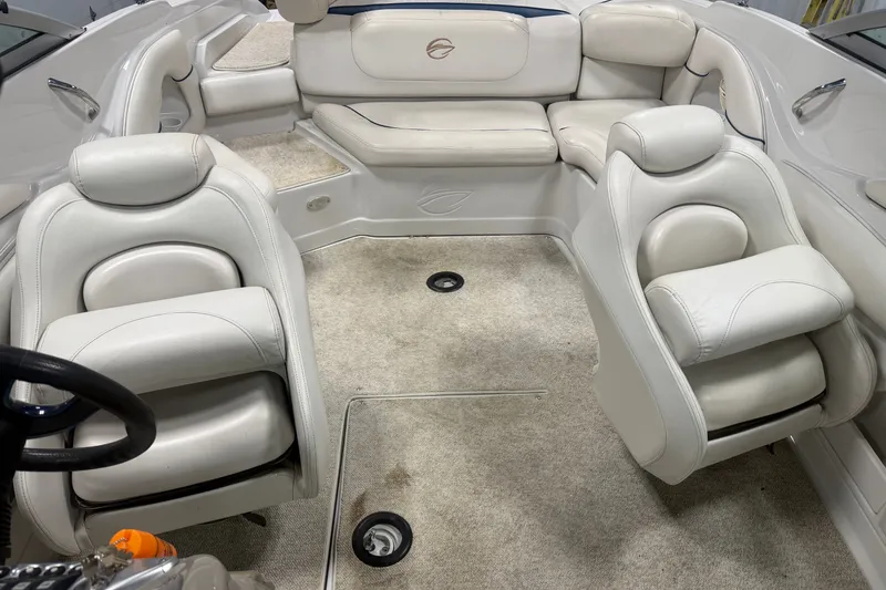 Slide: The Image of Interior of a 2005 Crownline 226 LS boat with white leather seating. - 15