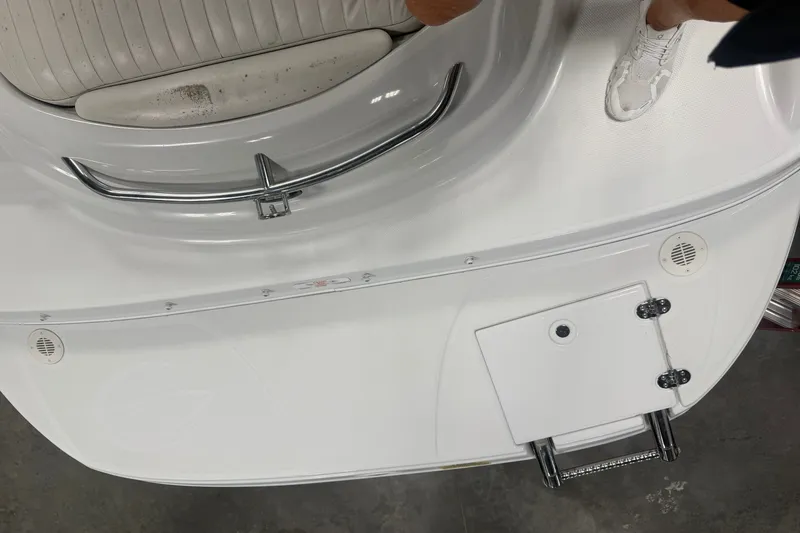 Slide: The Image of 2005 Crownline 226 LS boat interior with white seating and stainless steel details. - 17