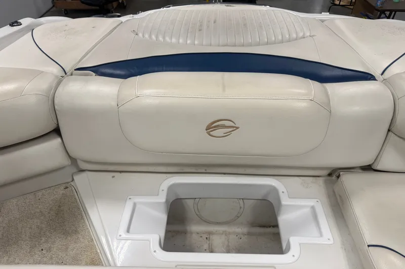 Slide: The Image of 2005 Crownline 226 LS boat interior with white and blue seating. - 21