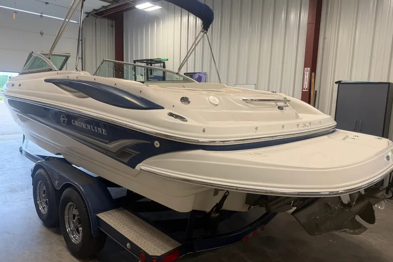 The Image of 2005 Crownline 226 LS boat on trailer in indoor storage facility. - 1