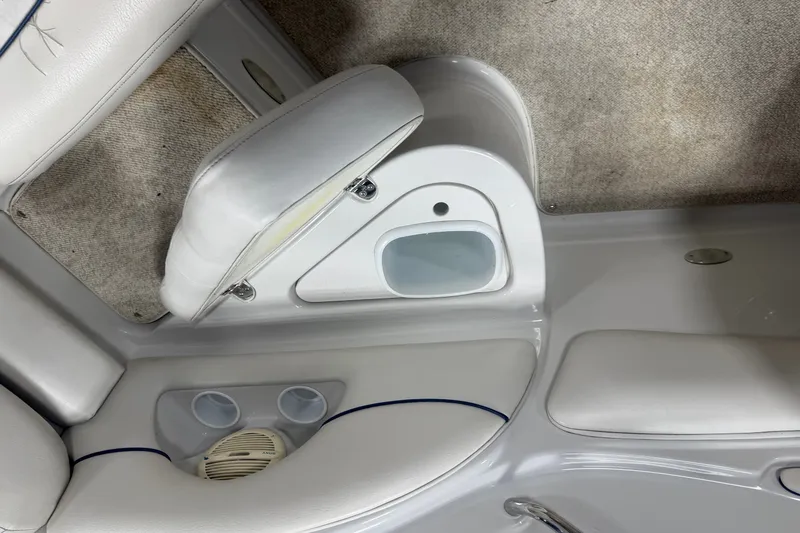 Slide: The Image of Interior of a 2005 Crownline 226 LS boat, featuring seating and cup holders. - 24