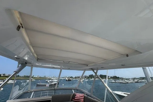 Slide: The Image of Flybridge view of 2023 Azimut Fly 50 yacht with scenic marina backdrop. - 42