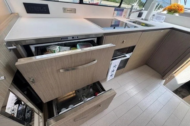 Slide: The Image of Modern kitchen interior of 2023 Azimut Fly 50 yacht with open drawers and sleek design. - 17
