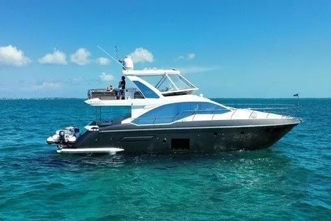 The Image of 2023 Azimut Fly 50 yacht cruising on clear blue ocean waters. - 1