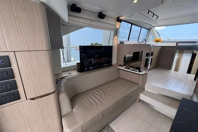 Slide: The Image of Luxurious interior of 2023 Azimut Fly 50 yacht with modern furnishings and entertainment system. - 15
