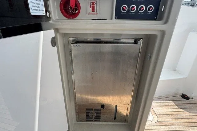 Slide: The Image of 2023 Azimut Fly 50 yacht interior with control panel and storage compartment. - 11