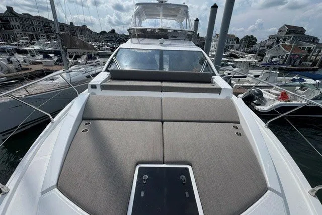 Slide: The Image of 2023 Azimut Fly 50 yacht with spacious deck, docked in a marina. - 7