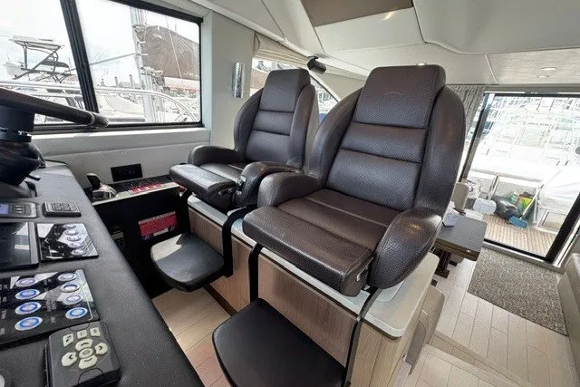 Slide: The Image of Interior of 2023 Azimut Fly 50 yacht with luxurious seating and control panel. - 19