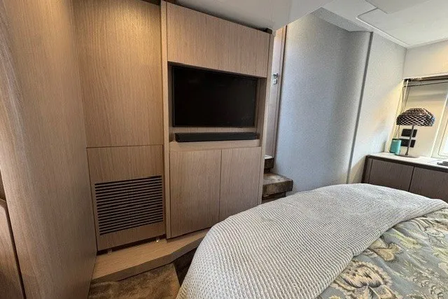Slide: The Image of Luxurious interior of 2023 Azimut Fly 50 yacht featuring a modern bedroom with TV. - 35