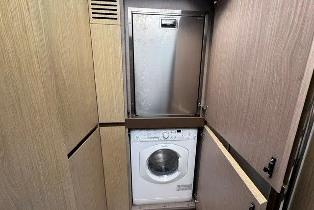Slide: The Image of Laundry area in 2023 Azimut Fly 50 yacht with washer and storage. - 25
