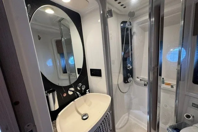 Slide: The Image of Luxurious bathroom in 2023 Azimut Fly 50 yacht with modern fixtures and elegant design. - 29