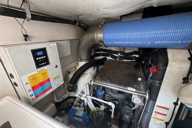 Slide: The Image of Engine room of 2023 Azimut Fly 50 yacht, featuring control panel and ventilation system. - 48