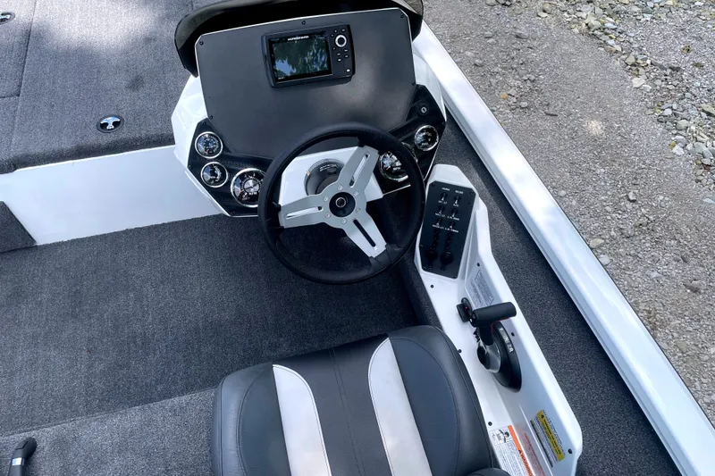 Slide: The Image of The image shows the cockpit of a 2023 Vexus AVX189C boat with a modern helm. - 10