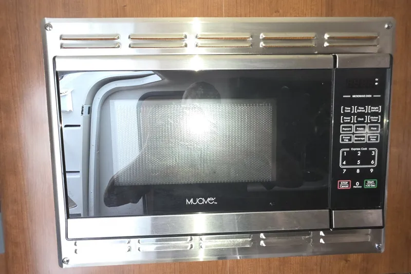 Slide: The Image of Built-in microwave oven in 2017 Crownline 325 SCR boat kitchen. - 31