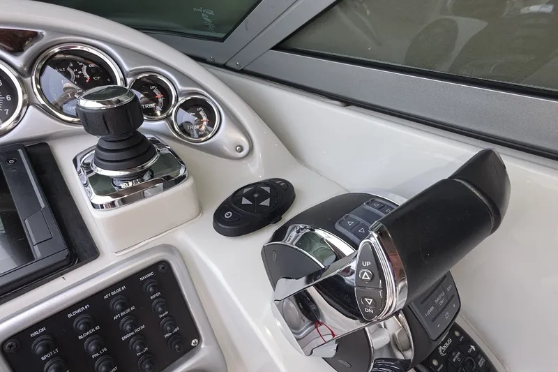 Slide: The Image of Control panel of a 2017 Crownline 325 SCR boat with gauges and throttle. - 15