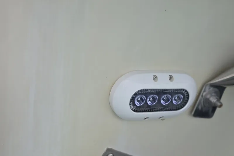 Slide: The Image of LED light fixture on 2017 Crownline 325 SCR boat exterior. - 25