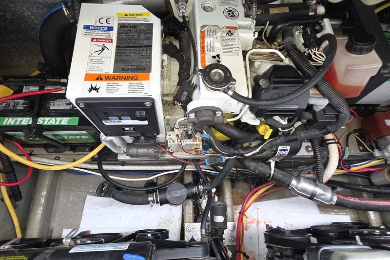 Slide: The Image of Engine compartment of a 2017 Crownline 325 SCR boat with Kohler power systems. - 44