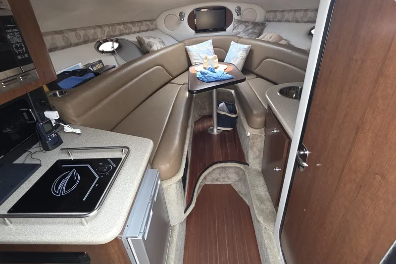 Slide: The Image of Luxurious interior of 2017 Crownline 325 SCR boat with cozy seating and modern amenities. - 35