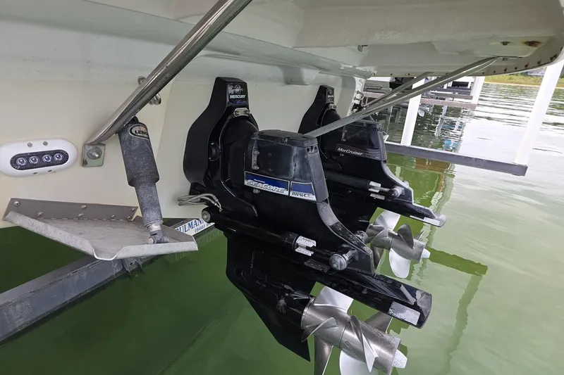 Slide: The Image of 2017 Crownline 325 SCR boat with dual Mercury SeaCore Bravo engines in water. - 46
