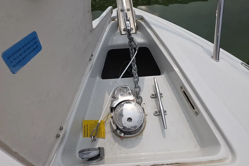 Slide: The Image of Anchor compartment of 2017 Crownline 325 SCR boat with chain and winch. - 26